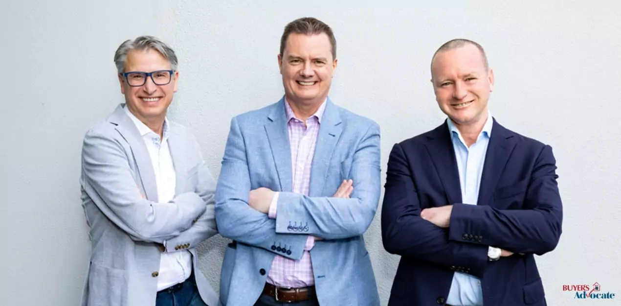 Professional buyer’s advocates posing together – experts who help home buyers ask the right questions