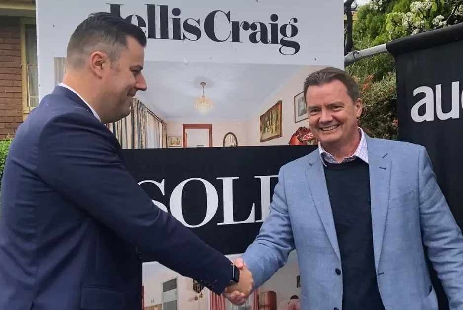 Buyers advocate with a client celebrating a successful property purchase in Surrey Hills